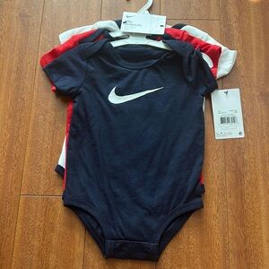 Nike infant bodysuits.